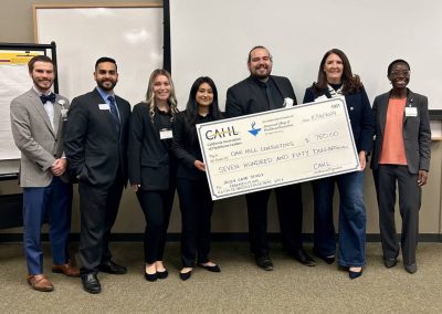 Team Oak Hill Consulting group photo with 750 dollar check